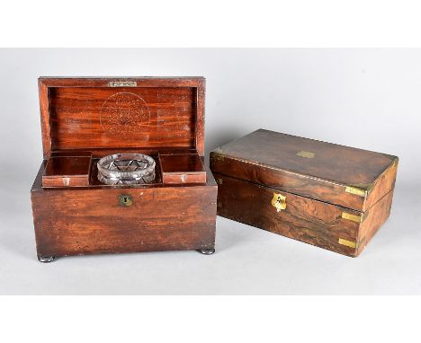 A George III mahogany tea caddy, with cut glass mixing bowl and two tea canisters with brass carrying handle, 33 cm x 18 cm h