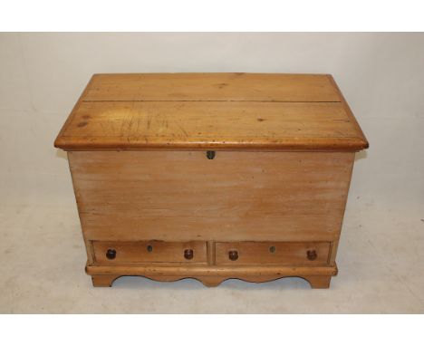 A pine blanket box, with two base drawers, hinged lid, shaped apron, bracket feet, 97 cm x 66 cm high x 55 cm 