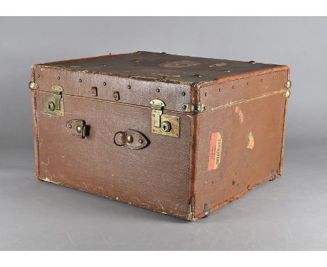 An Edwardian canvas and leather travelling trunk,  with fitted shelf and a WWII scrap album of cartoons, 51 cm wide X 32 cm h