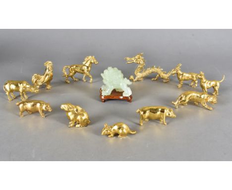 A collection of Singapore airline gifts, including eleven gilt Chinese year figures including tigers, dragon, rat together wi