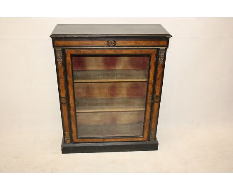 A 19th Century walnut and ebonised pier cabinet, glazed panel door to three shelf interior, gilt metal mounts, 79 cm x 98 cm 