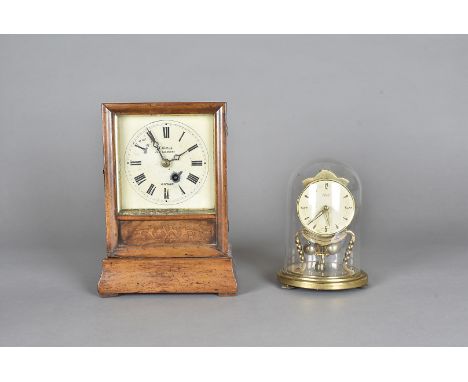 A Victorian mantel clock, having brass metal movement encased within wooden frame, the dial painted with arabic numerals and 