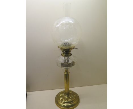 A brass oil lamp with an etched glass shade and Hinks no 2 burner and cut glass reservoir - Height 68cm - in generally good c