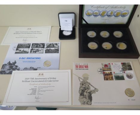 A silver proof £5 75th Anniversary D-Day coin, a British Army six medal commemorative set and two World War One Brilliant coi