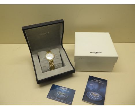 An 18ct yellow gold and diamond Longines Conquest Quartz gents bracelet watch with white dial and calendar - Width 35mm inclu