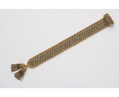 Bicolor-Flechtarmband mit Quasten18 kt Gelbgold. Geschmeidiges Band aus Fuchsschwanzketten-Geflecht mit umlaufender Kordelrah
