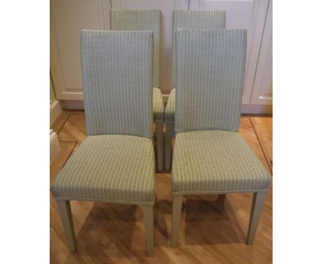 A set of four Lloyd Loom pale green dining chairs