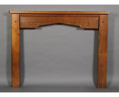 Bob Hunter of Thirlby 'Wren Man', an oak fireplace having a mantel above a lappet border, the arched aperture carved with wre