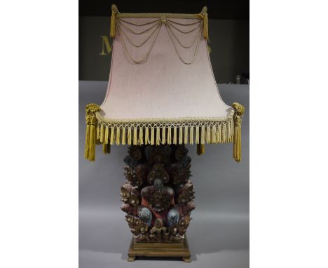 A Chinese carved and stained wood table lamp of square section carved in relief with tiered trefoils, on a square stepped bas