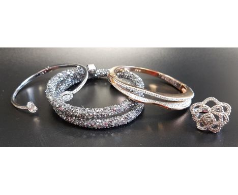 SELECTION OF SWAROVSKI CRYSTAL JEWELLERYcomprising a Crystaldust double bangle, two other bangles and a flower design ring (4