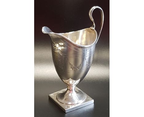 WILLIAM IV SILVER CREAM JUGraised on a square base, the body decorated with swags and inscribed R B L, London 1831, approxima