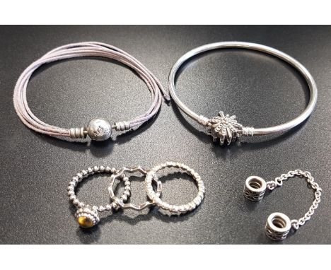 SELECTION OF PANDORA JEWELLERYcomprising a bangle with CZ set flower clasp, a Floral safety chain, three rings - Heart Band, 