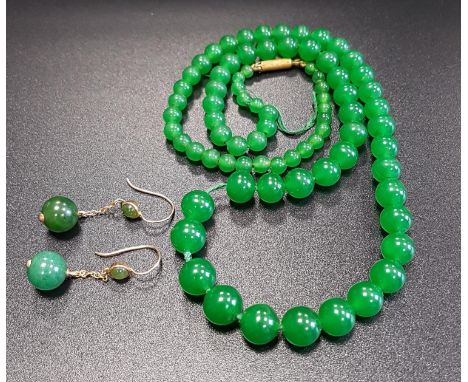 GRADUATED GREEN JADE BEAD NECKLACE43.5cm long; together with a pair of nine carat gold mounted jade coloured hardstone drop e