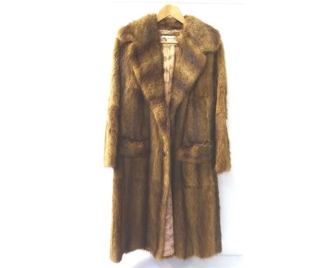 LADIES VINTAGE MUSQUASH FULL LENGTH COATwith pockets and button fastening, bearing a trade label for 'G & J Fields of Glasgow