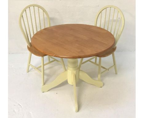 CIRCULAR TEAK KITCHEN TABLEwith shaped drop flaps, standing on a turned painted column with four outswept supports, 92cm wide