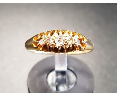 DIAMOND THREE STONE RINGon eighteen carat gold shank, the diamonds totalling approximately 0.12cts, ring size J-K, total weig