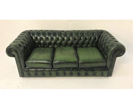 CHESTERFIELD THREE SEAT SOFAin green leather with button back and arms with decorative stud detail, on castors, 195cm wide 