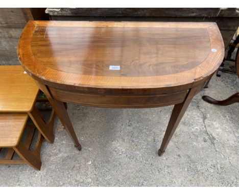 A 19TH CENTURY MAHOGANY AND INLAID FOLD OVER CARD TABLE ON TAPERING LEGS WITH SPADE FEET, 35.5" WIDE