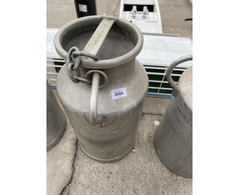 A SMALL ALUMINIUM MILK CHURN WITH LID