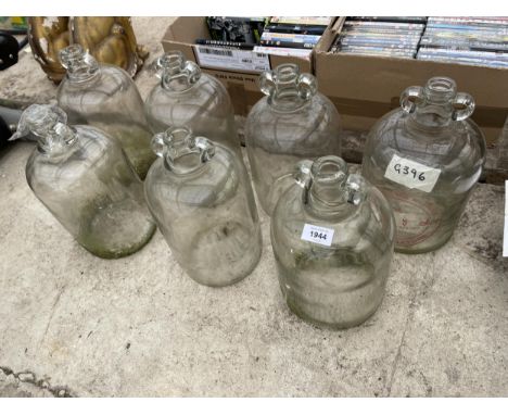 SEVEN VINTAGE GLASS DEMI JOHNS