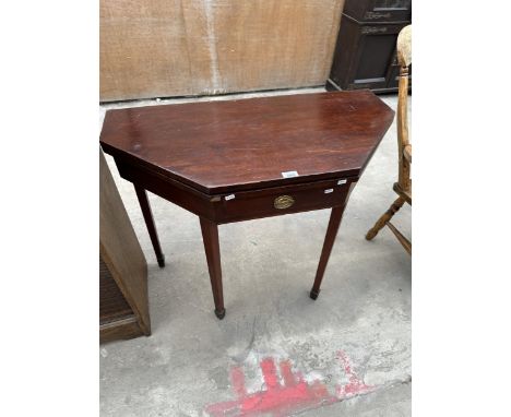 A MAHOGANY FOLDING CARD TABLE WITH GREEN BAIZE TOP