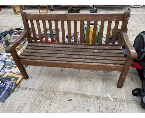 A TWO SEATER WOODEN SLATTED GARDEN BENCH