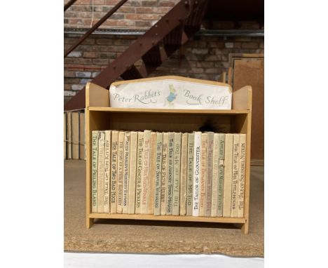 A COLLECTION OF BEATRIX POTTER F. WARNE &amp; CO LTD BOOKS ON A PETER RABBIT BOOK SHELF