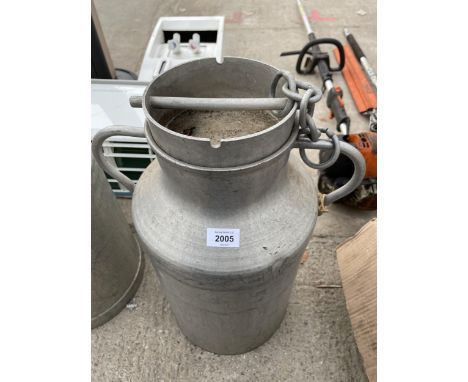 A SMALL ALUMINIUM MILK CHURN WITH LID