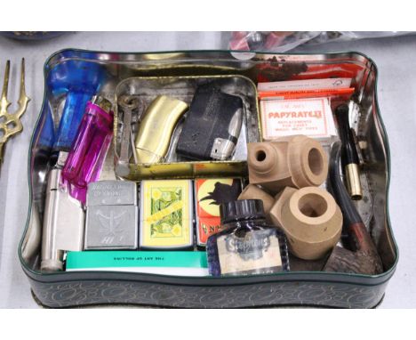 A TIN CONTAINING VINTAGE LIGHTERS, PIPES, STEPHEN'S FOUNTAIN INK, ETC.