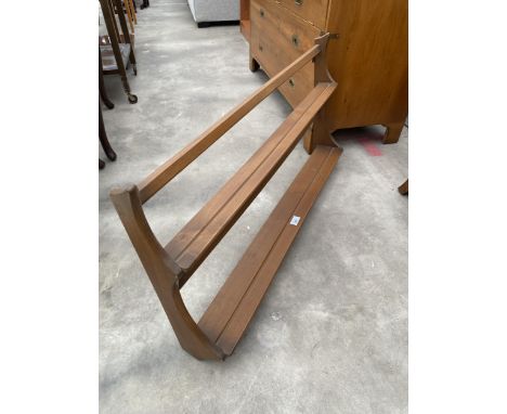 AN ERCOL TWO TIER WALL PLATE RACK