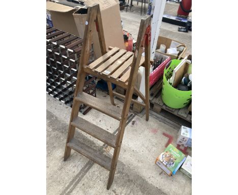 A SET OF VINTAGE FOUR RUNG WOODEN STEP LADDERS