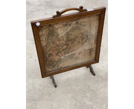 AN OAK FRAMED FIRESCREEN WITH TAPESTRY PANEL