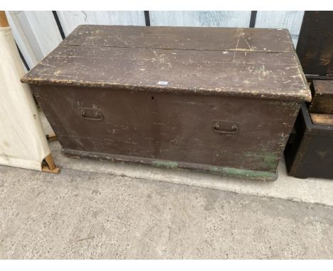 A LARGE VINTAGE PINE TOOL CHEST ON A WHEELED BASE