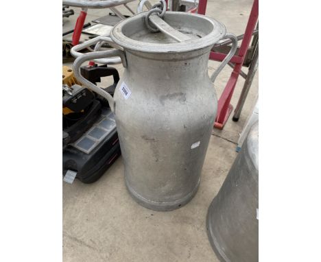 A SMALL ALUMINIUM MILK CHURN WITH LID