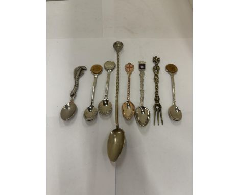 A COLLECTION OF SEVEN DECORATIVE SPOONS AND A PICKLE FORK
