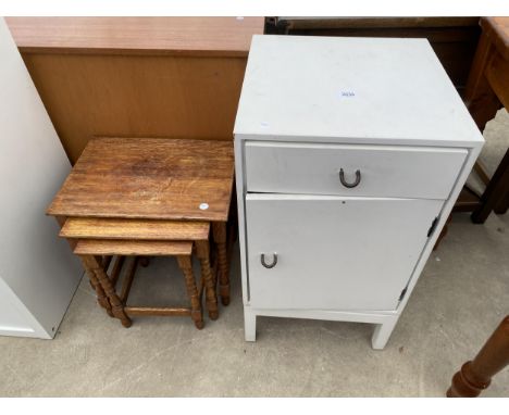 A NEST OF THREE OAK TABLES ON BOBBIN TURNED LEGS AND PAINTED STAG LOCKER