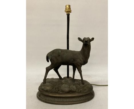 A CAST METAL FIGURE OF A DEER ON A PLINTH TABLE LAMP - A/F, ANTLERS MISSING, HEIGHT TO THE TOP OF THE DEER 32CM, WIDTH APPROX