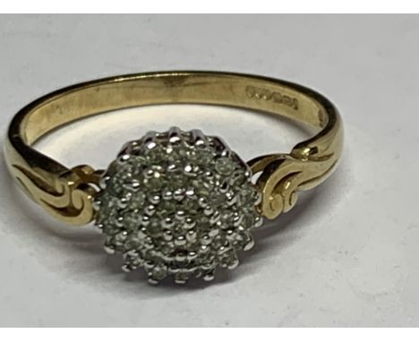 A 9 CARAT YELLOW GOLD RING WITH A DIAMOND CLUSTER SIZE R