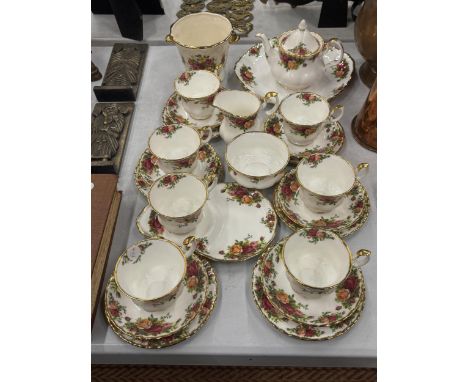 A COUNTRY ROSES TEASET TO INCLUDE TEA POT, CAKE/SANDWICH PLATE, TEACUPS, SAUCERS AND SIDE PLATES, MILK AND SUGAR BOWL, A COTT