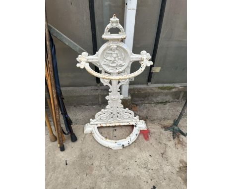 A DECORATIVE CAST METAL STICK STAND (A/F) AND NO DRIP TRAY