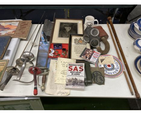 A MIXED LOT TO INCLUDE A GAS MASK, SWORDS, MILITARY BUTTONS, ENAMEL BADGES, RAF PLATE, ETC.,