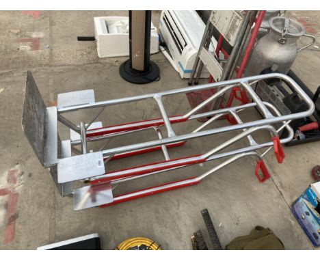 THREE METAL SACK TRUCK BODIES AND A STEP LADDER