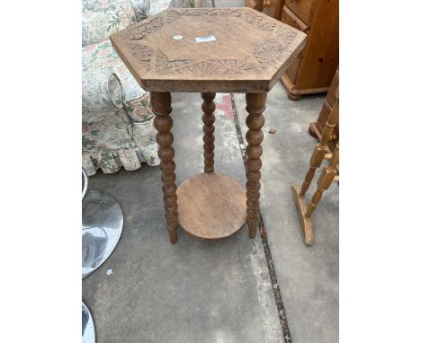 A VICTORIAN OAK HEXAGONAL TWO TIER PLANT STAND ON BOBBIN TURNED SUPPORTS