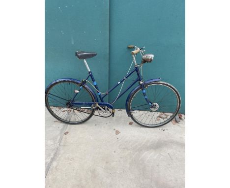 A VINTAGE BICYCLE WITH ORIGINAL FRONT LIGHT
