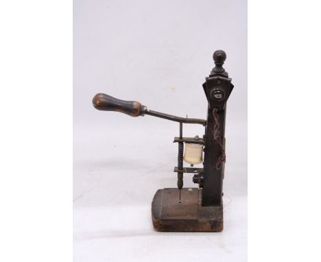 A VINTAGE EARLY BASIC SEWING MACHINE
