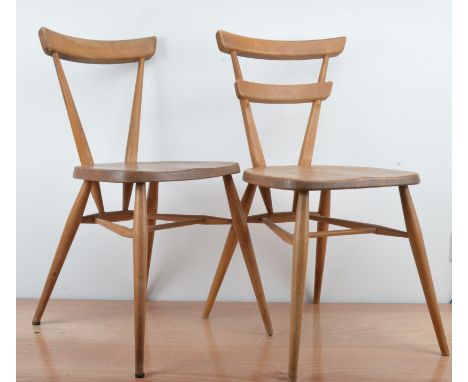 A mid century Ercol kitchen chair, 74cm H x 39cm W, with an impressed mark to the underside of the seat, together with a simi