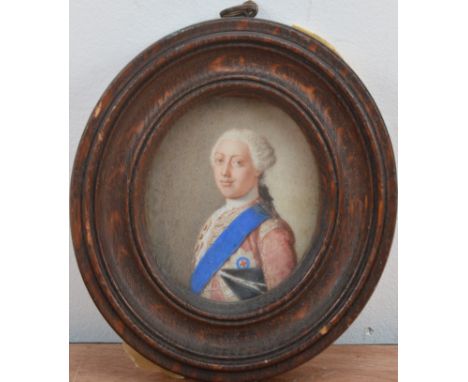 A 19th century or earlier portrait miniature of George III, rectangular in shape, some wear to the corners, the panel measure