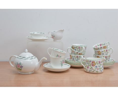 A 20th century Susie Cooper 'Fragrance' pattern tea set for two, comprising two cups and saucers, a teapot, cream jug, sugar 