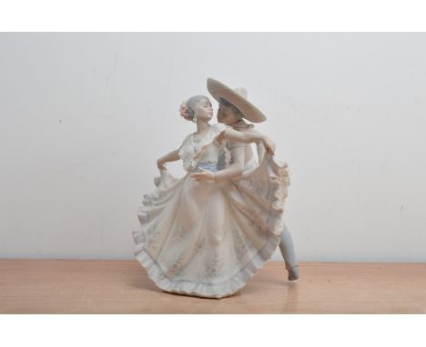 A Lladro ceramic bisque figural group, of 'Mexican Dancers' impressed and printed marks to the underside, 30cm high AF 