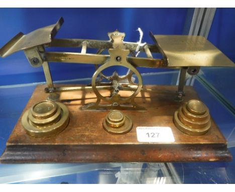 A SET OF POSTAL SCALES with stacking weights